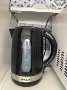 a black appliance with a mouse on top of it at Chambre privée indépendante au cœur du Luberon in Saint-Saturnin-les-Apt