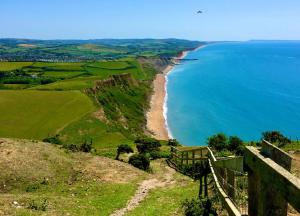 a view of a beach and the ocean at Golden Acre Jurassic Coastal Lodges ,Eype in Bridport