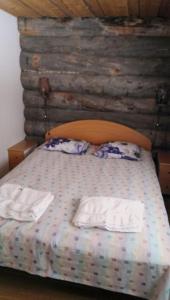 Postel nebo postele na pokoji v ubytování Vuokatti ski-in: Mökistä suksilla suoraan mäkeen tai ladulle