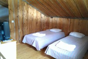 Postel nebo postele na pokoji v ubytování Vuokatti ski-in: Mökistä suksilla suoraan mäkeen tai ladulle