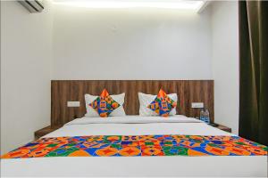 Kama o mga kama sa kuwarto sa FabHotel Chandigarh