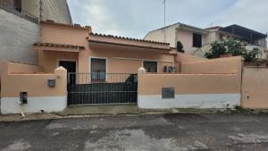 an empty parking lot in front of a house at Holiday Maria Luisa in Galtellì
