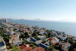 una vista aérea de una ciudad junto al océano en Poseidon La Manga Hotel & Spa - Designed for Adults, en La Manga del Mar Menor