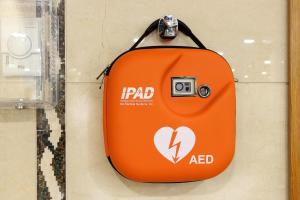 an orange suitcase with a camera on a wall at Hotel Poseidon Playa in Benidorm