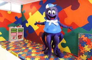 a cartoon mascot standing in a room with a wall at Hotel Poseidon Playa in Benidorm