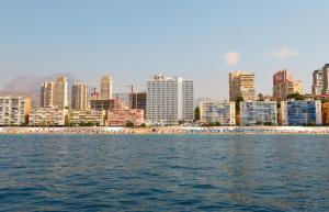 a view of a beach and a city from the water at Hotel Poseidon Playa in Benidorm