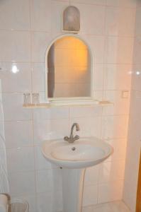 a bathroom with a sink and a mirror at Kahraman Hotel in Side