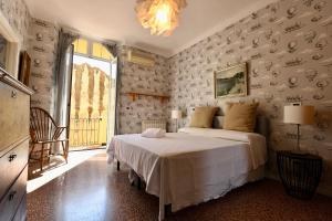 a bedroom with a bed and a large window at Hotel Villa Maria & Apartment in Varazze +82 photos