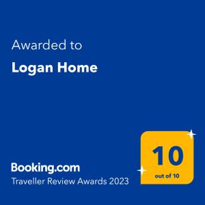 a yellow sign that says awarded to logan home at Logan Home in Stornoway