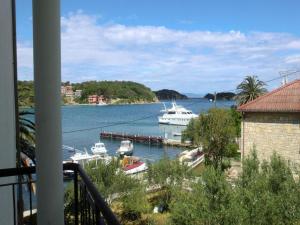 a view of a harbor with boats in the water at Apartment Sea in Supetarska Draga
