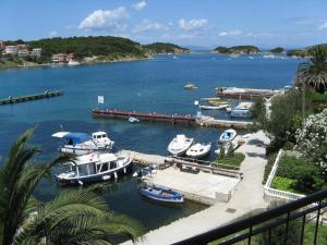 a group of boats are docked in a harbor at Apartment Sea in Supetarska Draga
