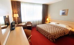 Cama o camas de una habitación en Rixwell Segevold Hotel