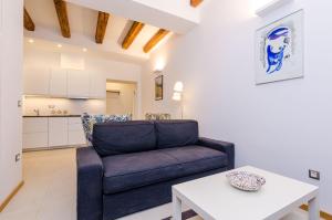 a living room with a couch and a table at Zelenci Apartments in Dubrovnik
