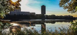 a view of a river with a city in the background at The Creteil Shelter - Duke Housing in Créteil