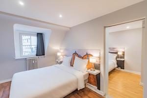 Postel nebo postele na pokoji v ubytování Hotel Herckmans