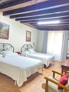Cama o camas de una habitación en Casa Sara