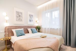 a bedroom with two beds and a window at Crystal House II - LoftAffair Collection in Kraków