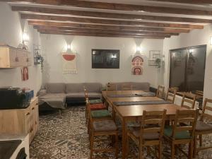 a living room with a table and a couch at Pensiunea Saseasca in Lereşti