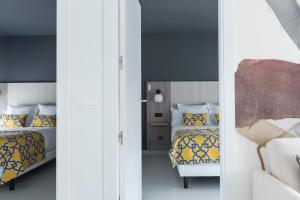 A bed or beds in a room at Apartamentos Las Torres