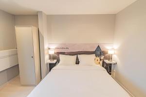 Postel nebo postele na pokoji v ubytování Hotel Herckmans