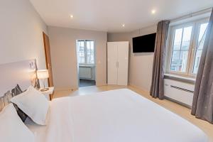 Postel nebo postele na pokoji v ubytování Hotel Herckmans