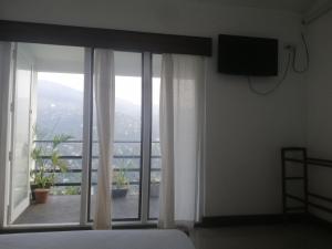 TV a/nebo společenská místnost v ubytování Glenview hotel & homestay