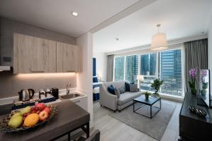 a kitchen and living room in a apartment at Centara West Bay Hotel & Residences Doha in Doha