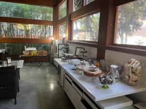 a kitchen with a counter with some food on it at Villa Alba Boutique Hotel in Pescara
