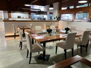 a dining room with a wooden table and chairs at Villa Alba Boutique Hotel in Pescara