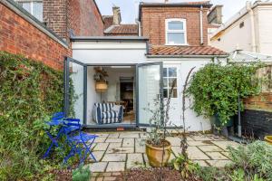 an extension to a house with a glass door at Lindley Terrace - Norfolk Holiday Properties in Norwich