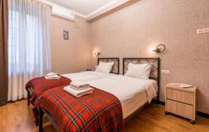 Rúm í herbergi á Hotel at Gomi 19