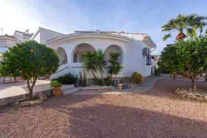 a large white house with trees in front of it at Casa Velazquez in Rojales