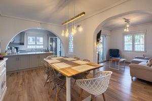 a kitchen and dining room with a table and chairs at Casa Velazquez in Rojales