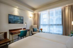Ένα ή περισσότερα κρεβάτια σε δωμάτιο στο Olive Tree Hotel