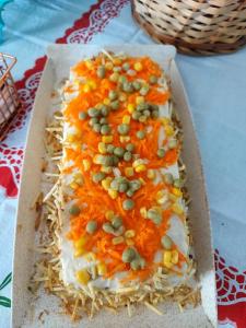 a cake with peas and cheese on top of it at Pousada da Jaqueira - EPP in Rio das Ostras