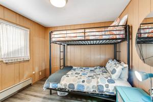 a bedroom with two bunk beds and a desk at Oceanfront Beauty in Blaine