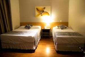 Cama o camas de una habitación en Hotel Nacional Inn Porto Alegre - Próximo ao Complexo Hospitalar Santa Casa e UFRGS