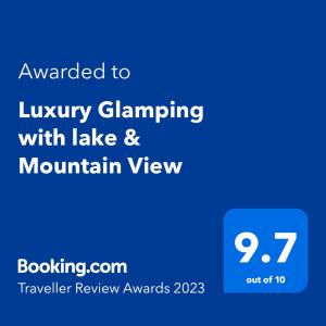 a screenshot of a phone with the text awarded to luxurygaming with lake and mountain at Luxury Glamping with lake & Mountain View in Culky