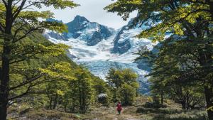 a person standing on a path in front of a mountain at Refugio de Glaciares in El Chalten +21 photos