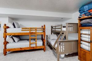 a room with two bunk beds and a ladder at Springs Manor in Colorado Springs
