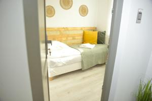 Posteľ alebo postele v izbe v ubytovaní Raba92 Apartman House