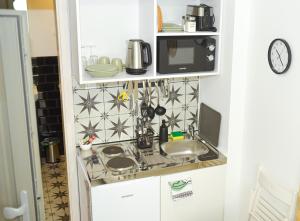 Kuchyňa alebo kuchynka v ubytovaní Raba92 Apartman House