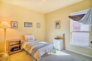 a bedroom with a bed and a window at Baton Rouge Vacation Rental about 4 Mi to LSU in Baton Rouge