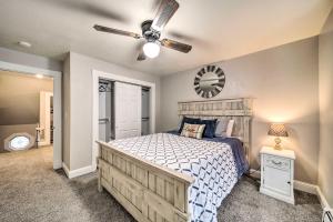 a bedroom with a bed and a ceiling fan at Charming Kellogg Home Near Outdoor Activities in Kellogg