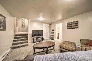 a living room with a couch and a table at Charming Kellogg Home Near Outdoor Activities in Kellogg