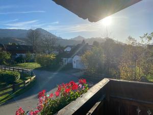 a view from the balcony of a house with flowers at Ferienwohnung Wagner in Bergen