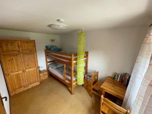 a room with a bunk bed in a room at Ferienwohnung Käppelehof in Schramberg