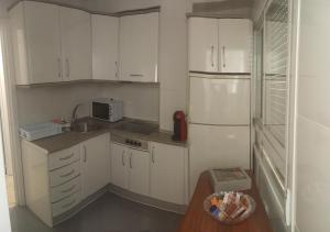 Kuchyň nebo kuchyňský kout v ubytování Apartamento Playmar Almeria