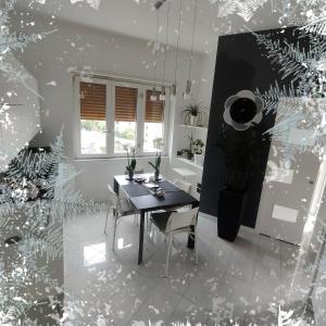 a dining room with a table and chairs and a window at B&B Stefani in Salerno +16 photos