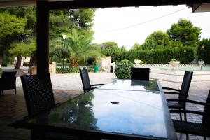 a table and chairs sitting on a patio at Villa Molinos in Novelda +50 photos